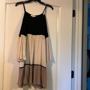Large black cream and tan cold shoulder top